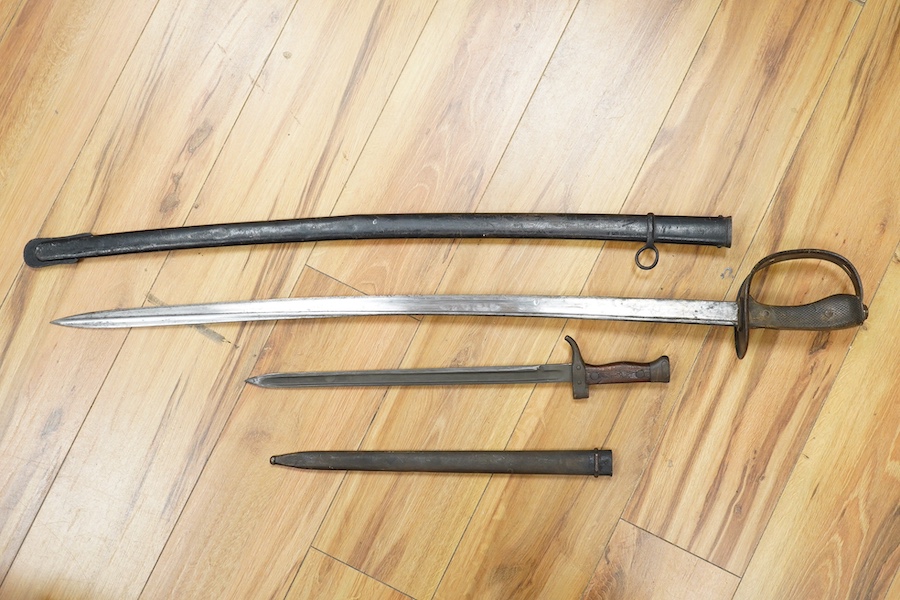 A First World War Turkish army officer’s sword, with pipe back blade, regulation iron guard pierced with crescent and moon, chequered horn grips, in its iron scabbard, together with an unidentified bayonet in its scabbar